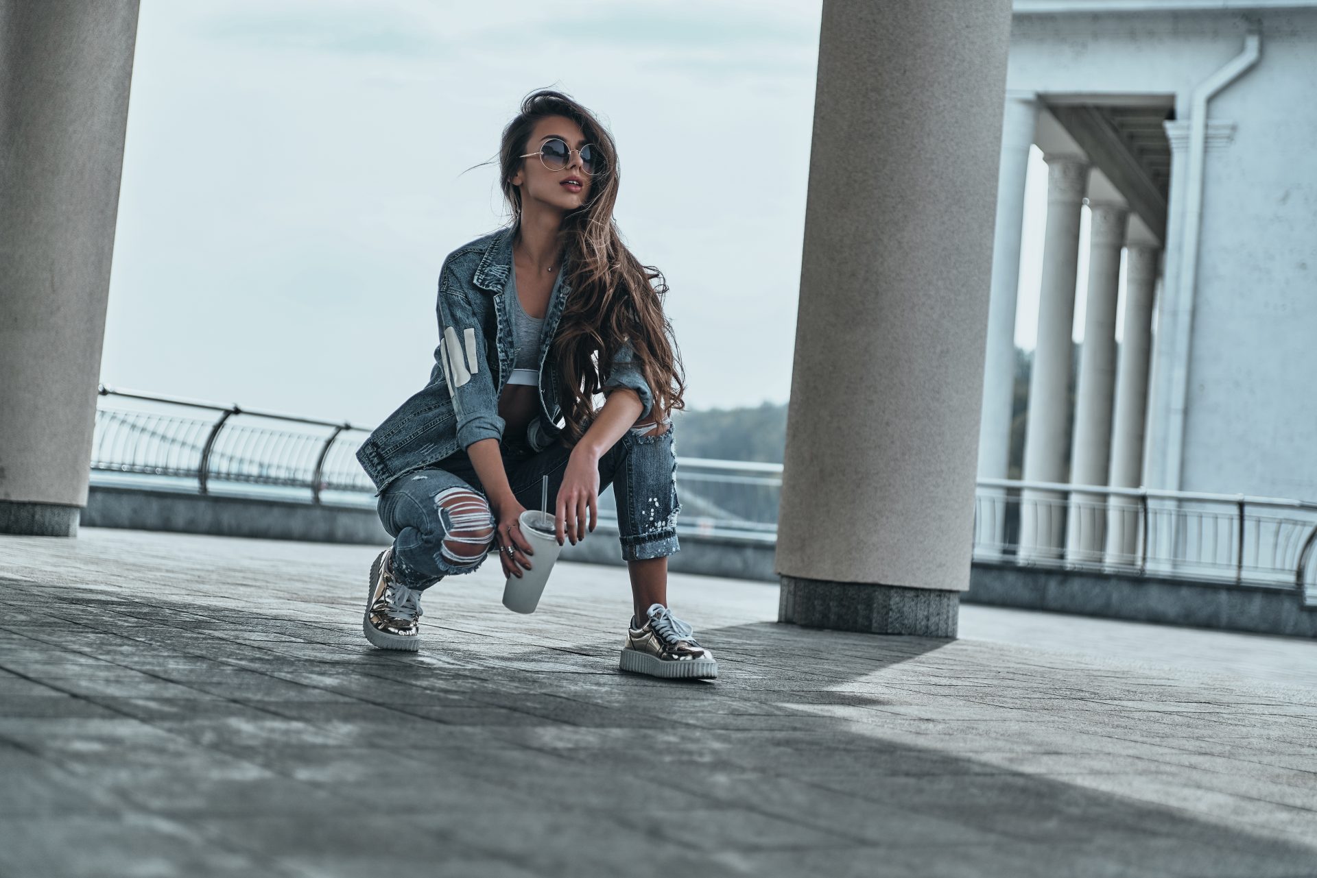 We're loving this edgy industrial chic look! Distressed denim, metallic trainers, and oversized sunnies create the perfect urban vibe. Our favourite styling trick? Layering a crop top under that cool denim jacket. Fancy more insider tips on nailing this look? Pop over to the blog for our complete style guide! #Industrial #Chic #Newcastle #Grit #Into #High #Fashion #Look #PinterestIdeas #PinterestTips