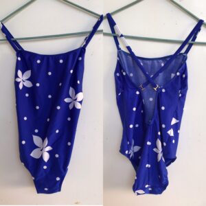 80S/90S Blue, One Piece Swimsuit That Features White Hibiscus & Polka Dots Pattern With Criss Cross Back. Small Size