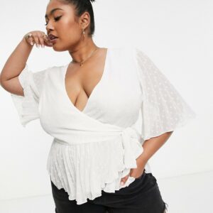 ASOS DESIGN Curve dobby wrap short sleeve blouse with pleated peplum hem in ivory-White