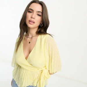 ASOS DESIGN Petite dobby wrap short sleeve blouse with pleated peplum hem in lemon-Yellow