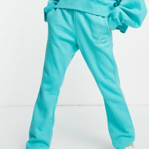 Nike Be Kind flared fleece joggers in teal-Blue