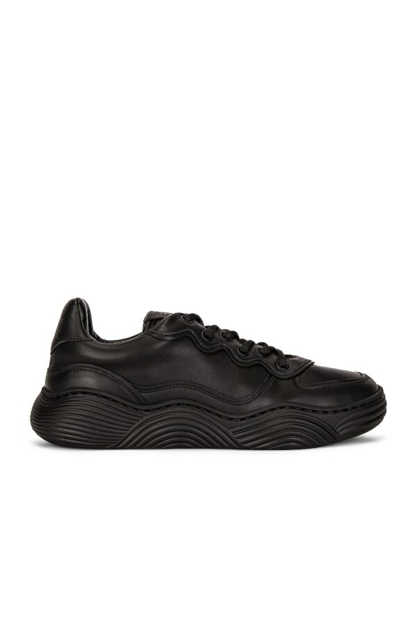 ALAÏA Veau Wave Sneakers in Noir - Black. Size 38 (also in 36, 37, 39).