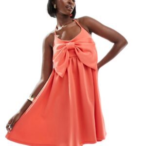 ASOS DESIGN strappy babydoll mini dress with oversized bow in coral-Orange