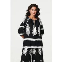 Izabel London Ikat Print Tassel Tie Neck Blouse women's Shirt in Black