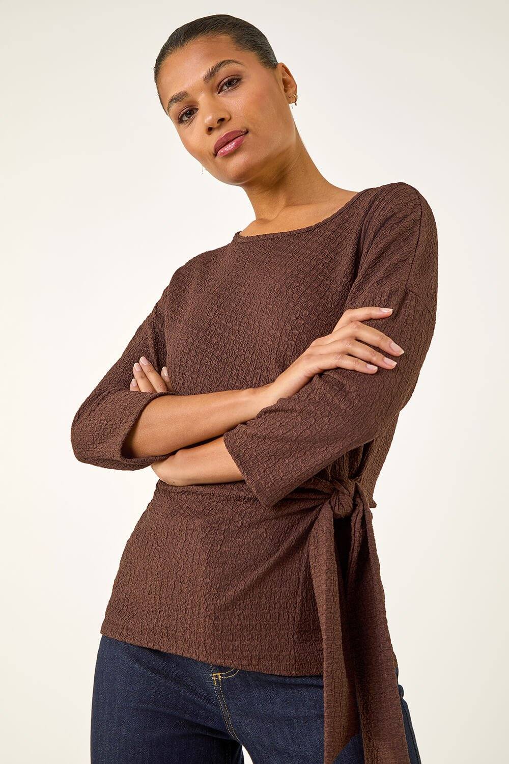 Roman Textured Asymmetric Wrap Top In Chocolate